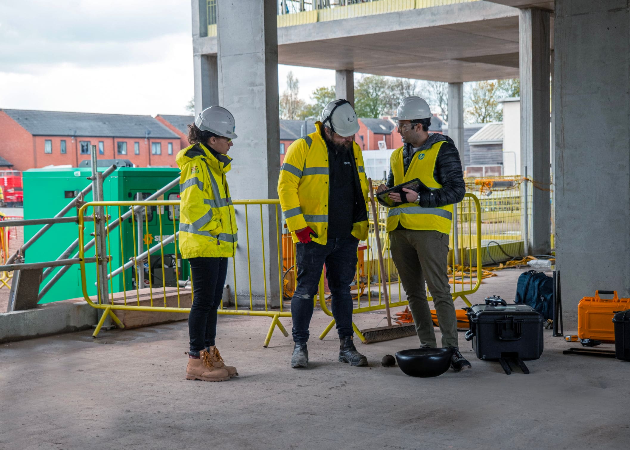 Construction workers collaborating on job site