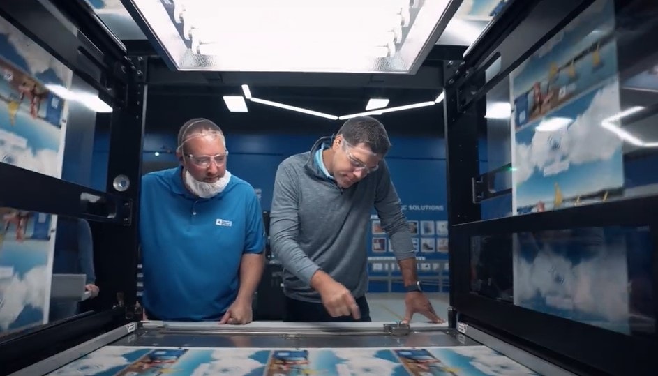 Men looking at a screen in a machine