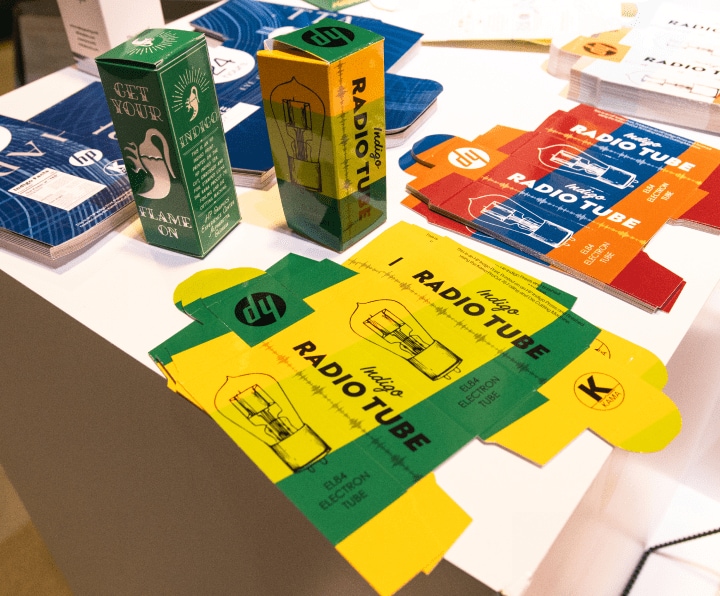 A table filled with various Folding cartons boxes. These boxes come in different shapes and sizes.