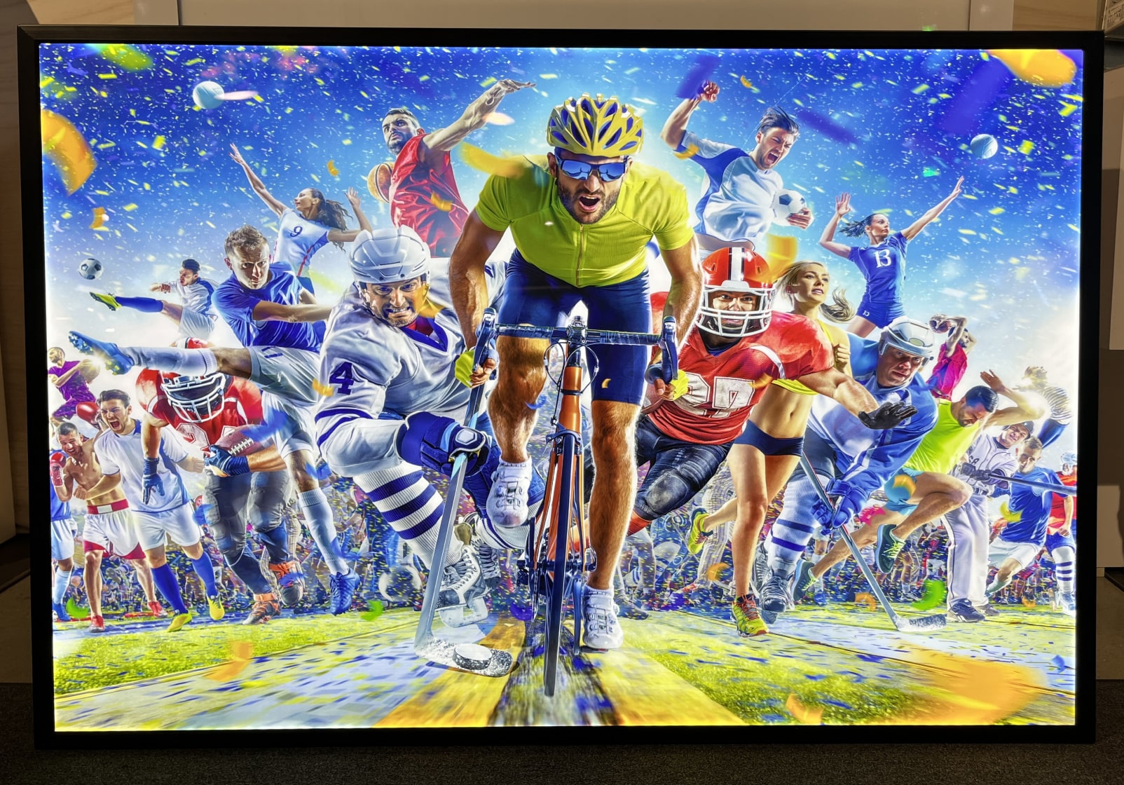 A tv screen with a picture of a person riding a bicycle