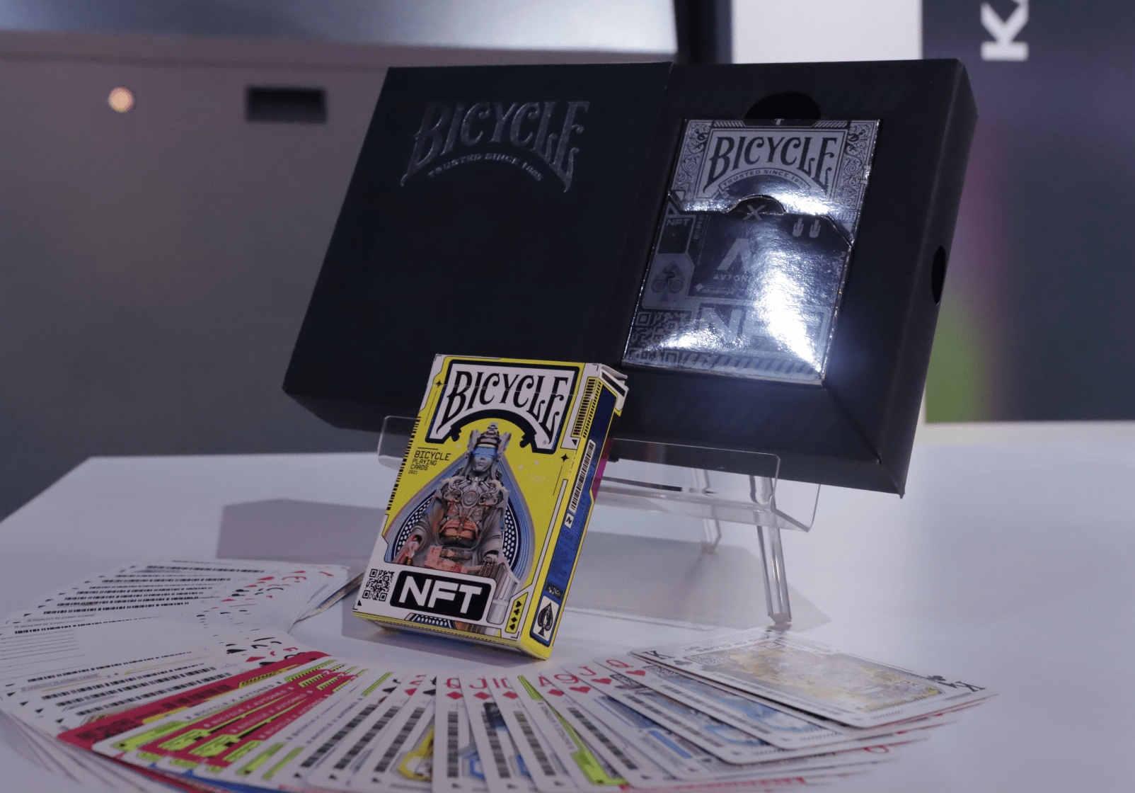 A carton box of playing cards on a table