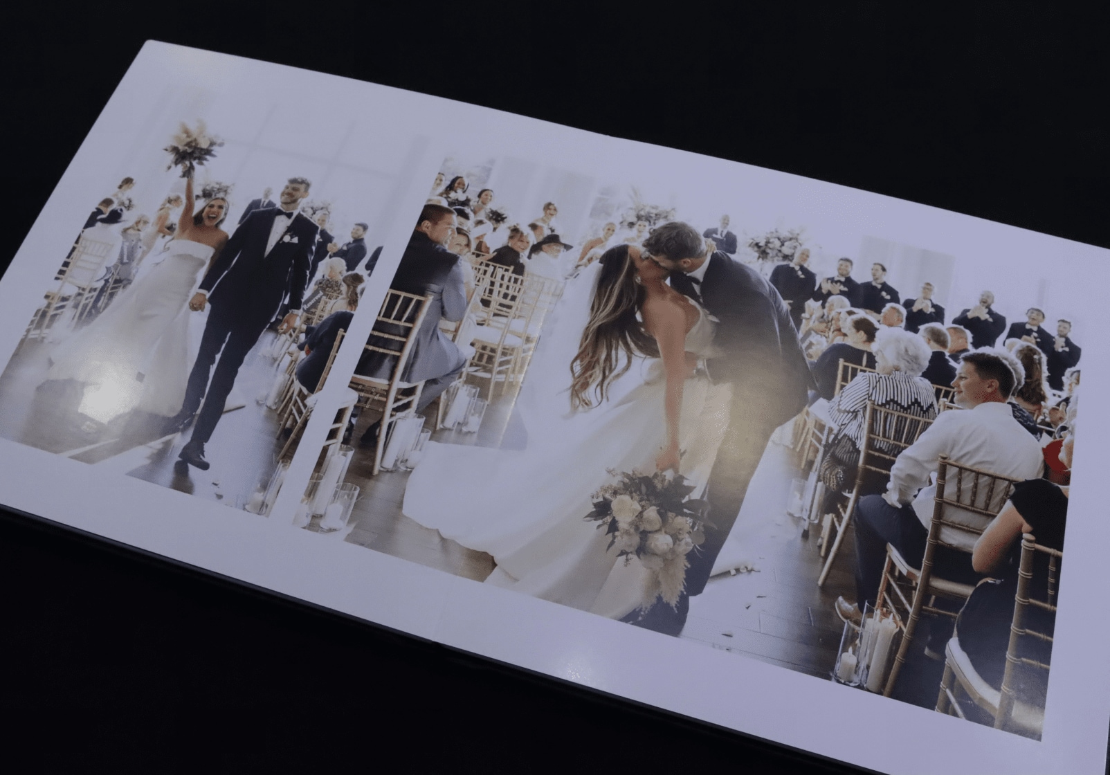 A wedding photo book with a couple kissing