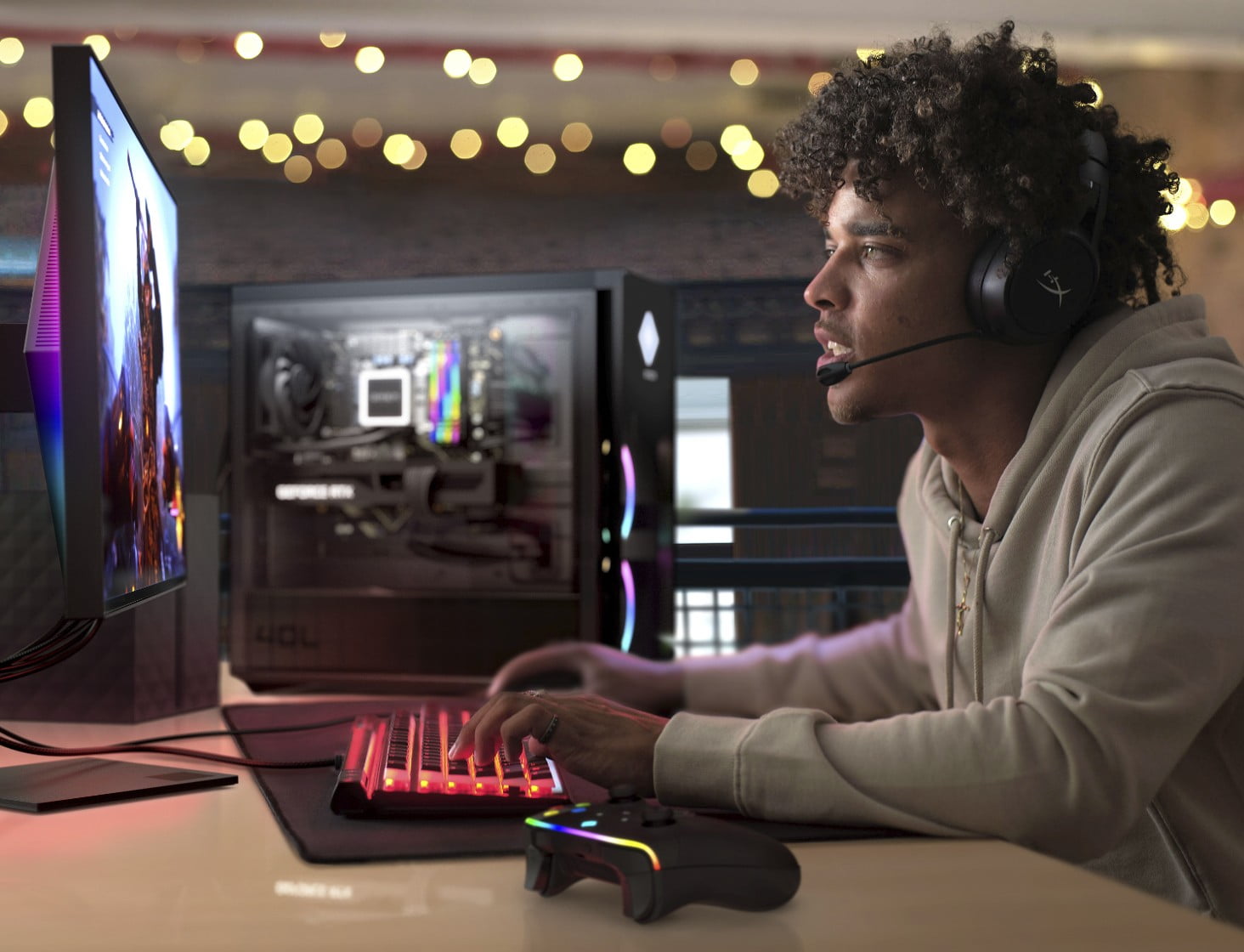 Man sitting at a desk using a headset and a HP gaming desktop