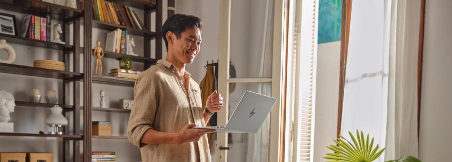 A person drawing directly on an HP Pavilion laptop on tablet mode using an HP pen.