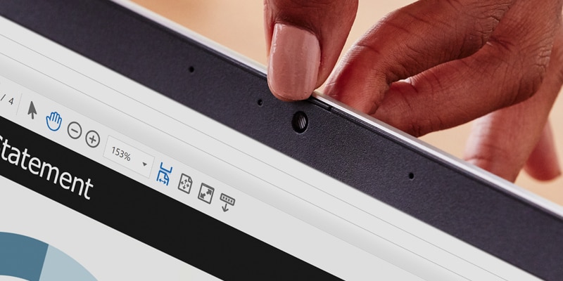 A close up to a lady's hand showing the secure cam in an HP laptop.