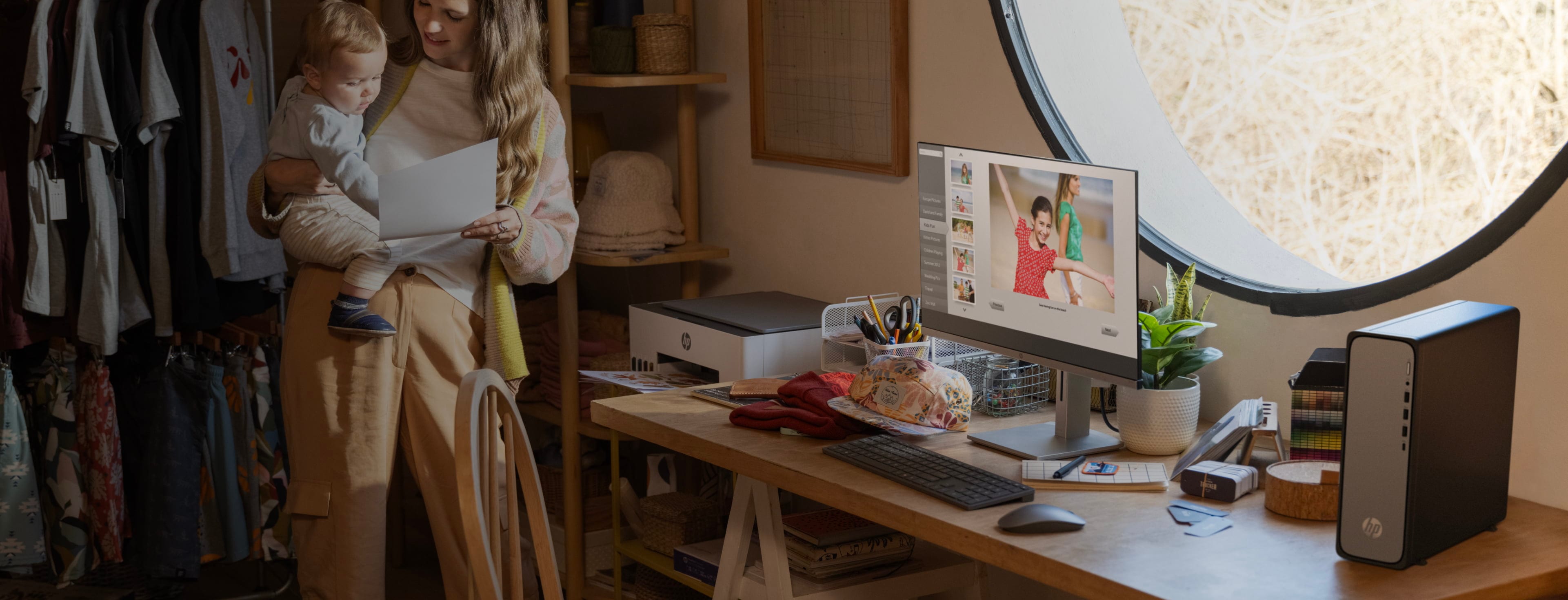 A woman showing a print aside an HP monitor connected to an HP OmniDesk Desktop PC