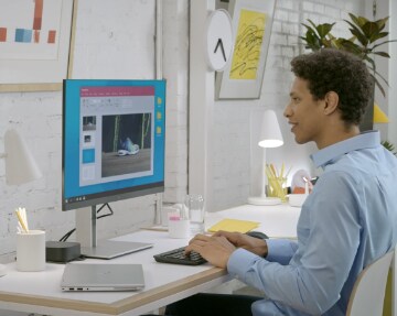 Video showing a man working in front of an HP Monitor