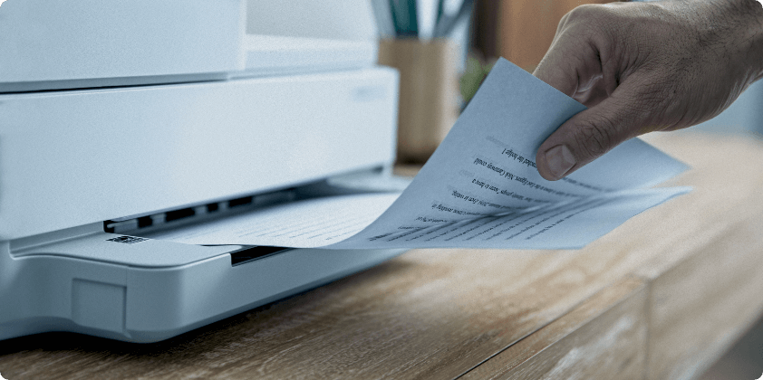 A man printing some documents at home.