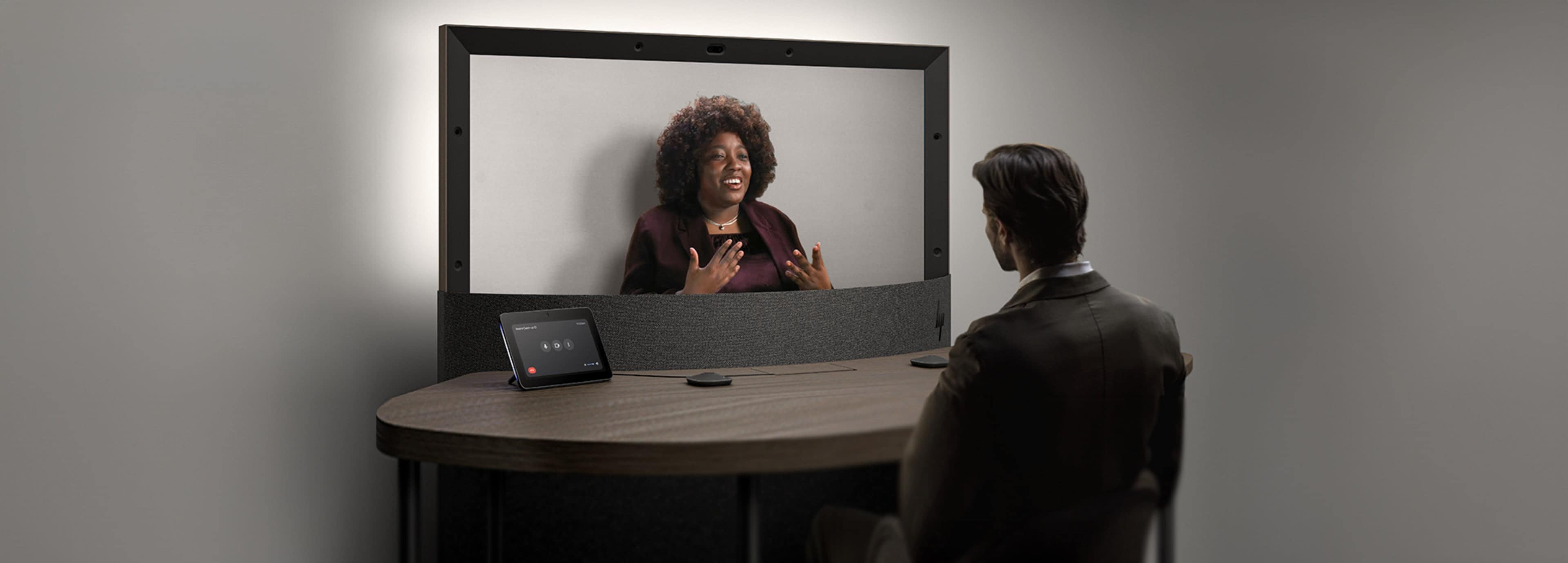 A man having a video conference to his female co-worker on the new HP and Google Project Starline