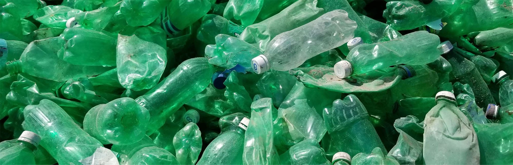 A large pile of plastic bottles to recycle.