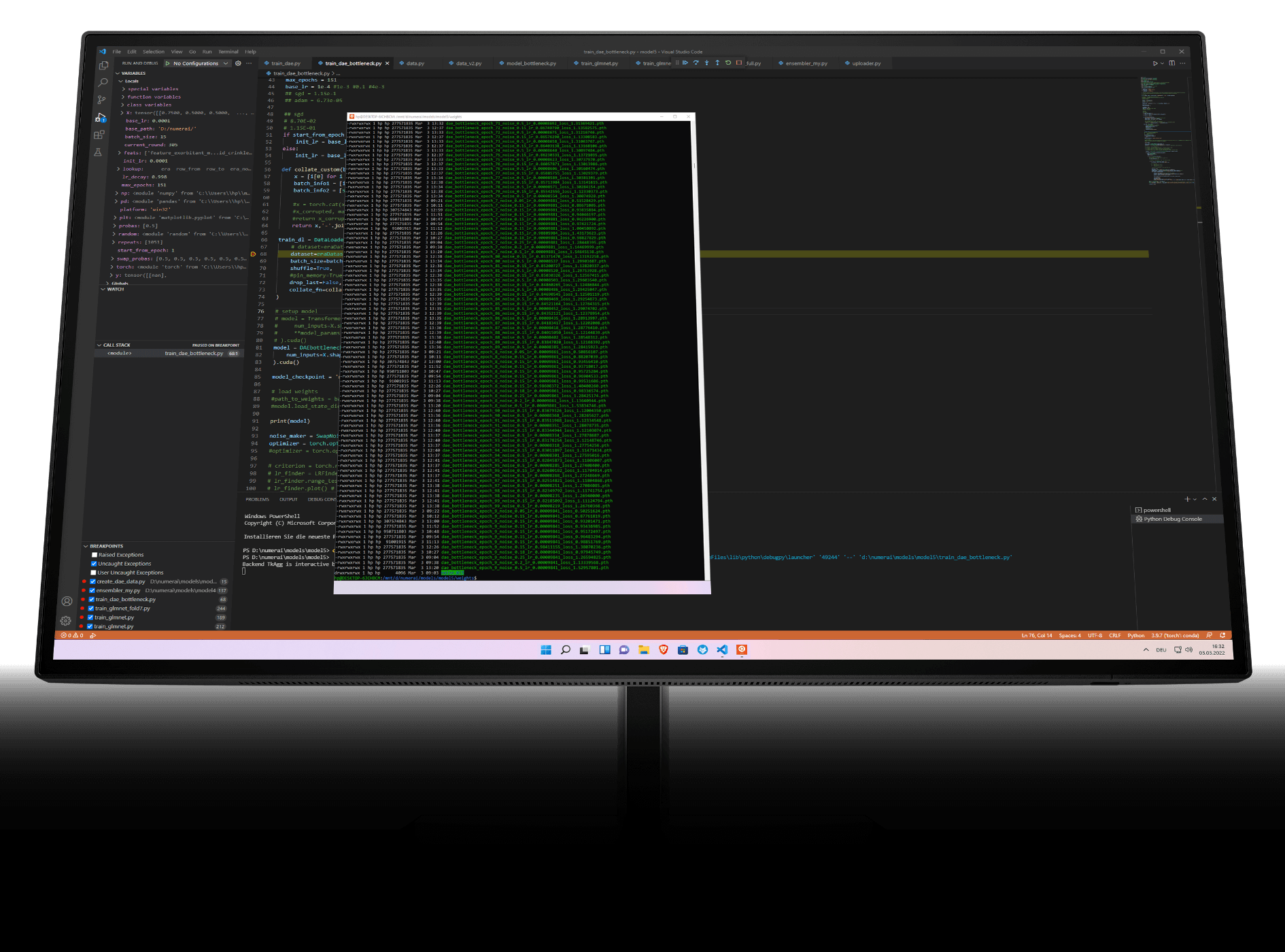 HP monitor display with development software interface.