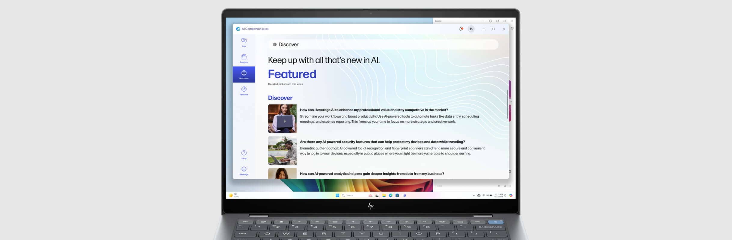 HP OmniBook laptop showing an HP AI Companion discover window on the screen