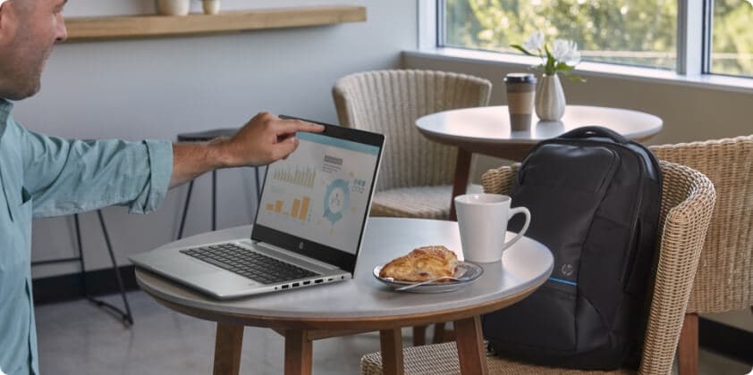 A man checking the Privacy camera on his HP laptop.