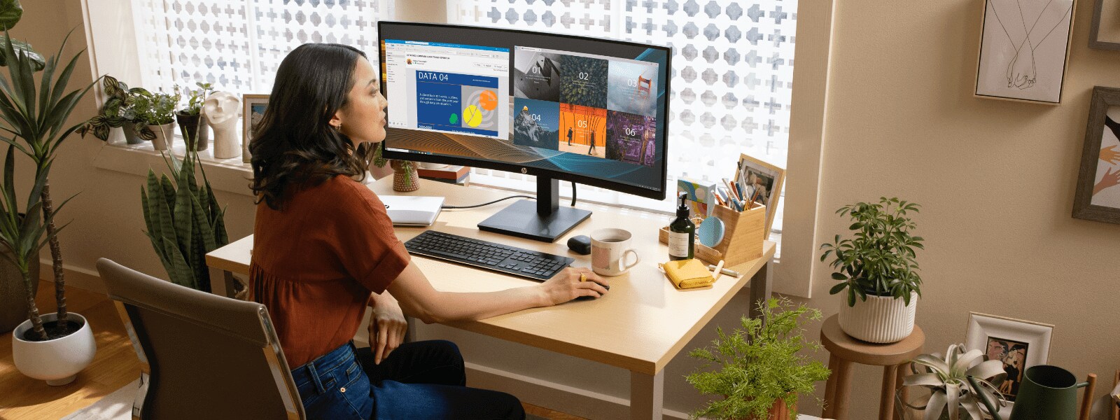 Woman working in front of an ultrawide curved monitor