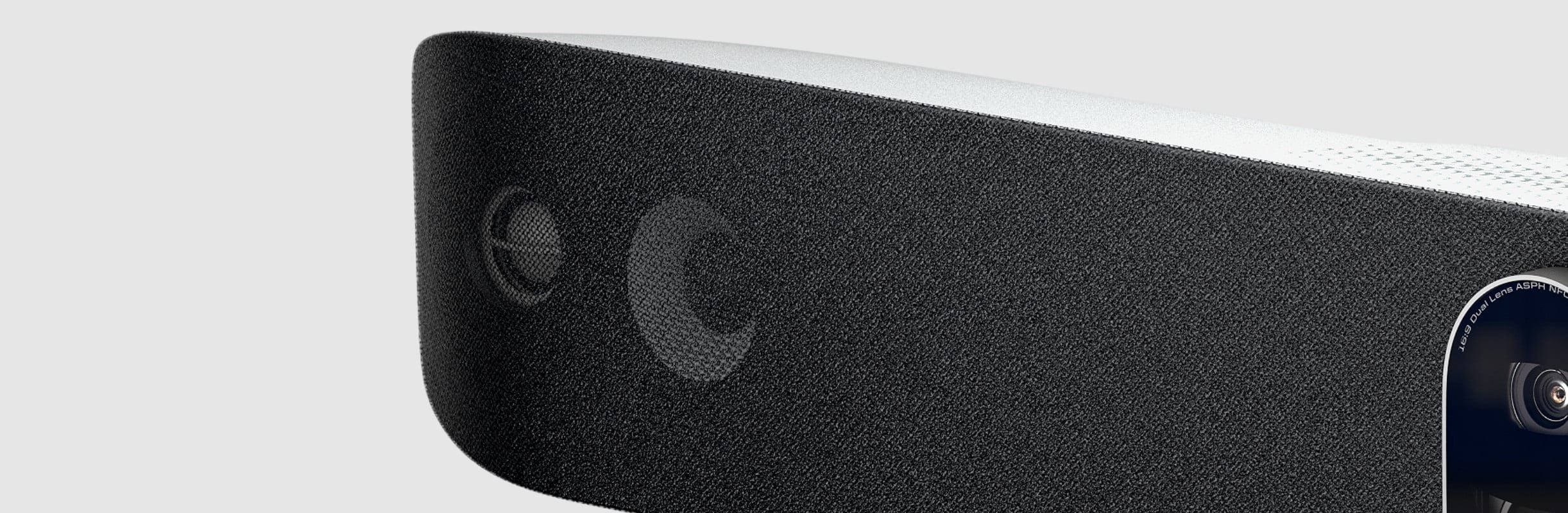 Close-up view of the speaker grill on the Poly Studio V72 usb video bar