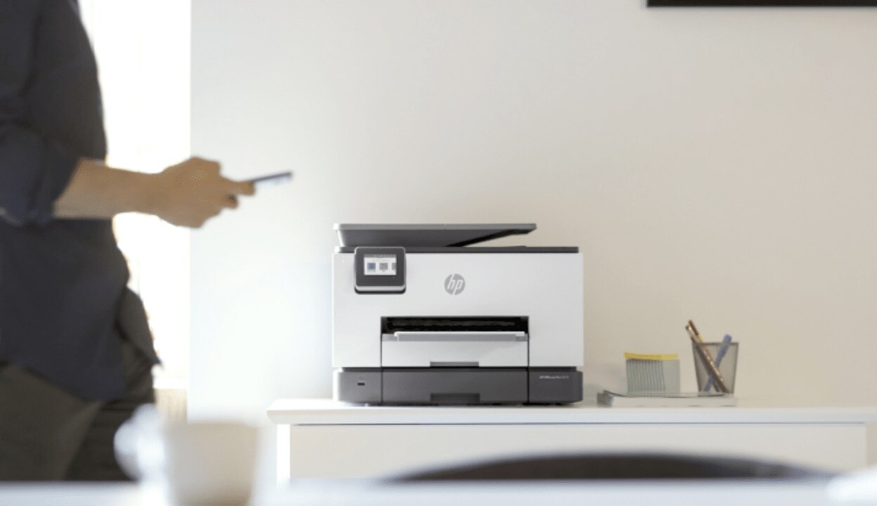 An HP printer stands in a table