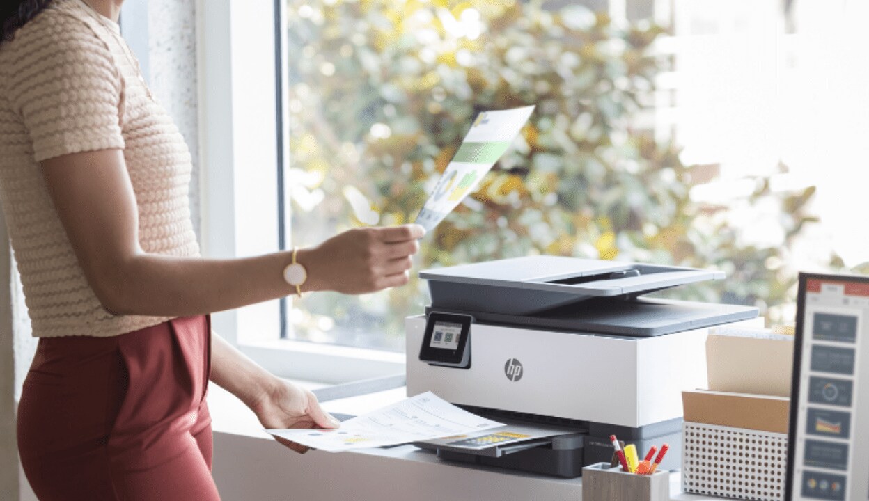 A woman using an HP printer