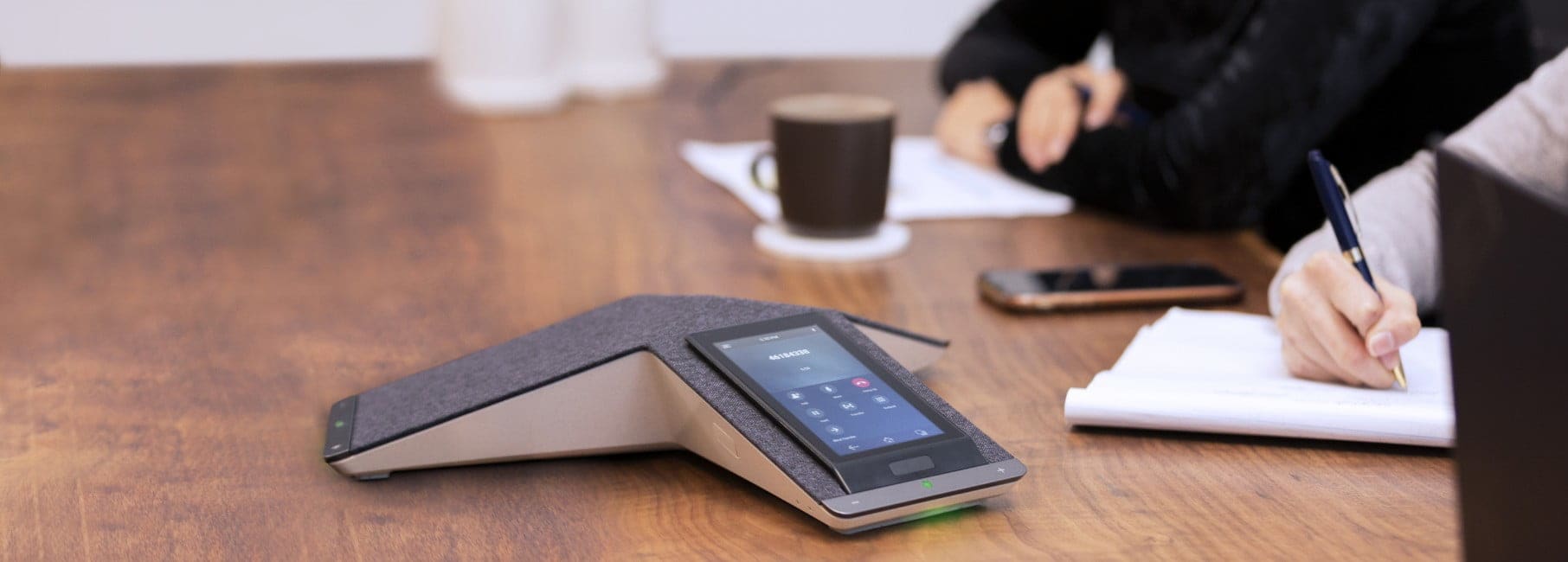 Image of a desk showing HP conference phones.