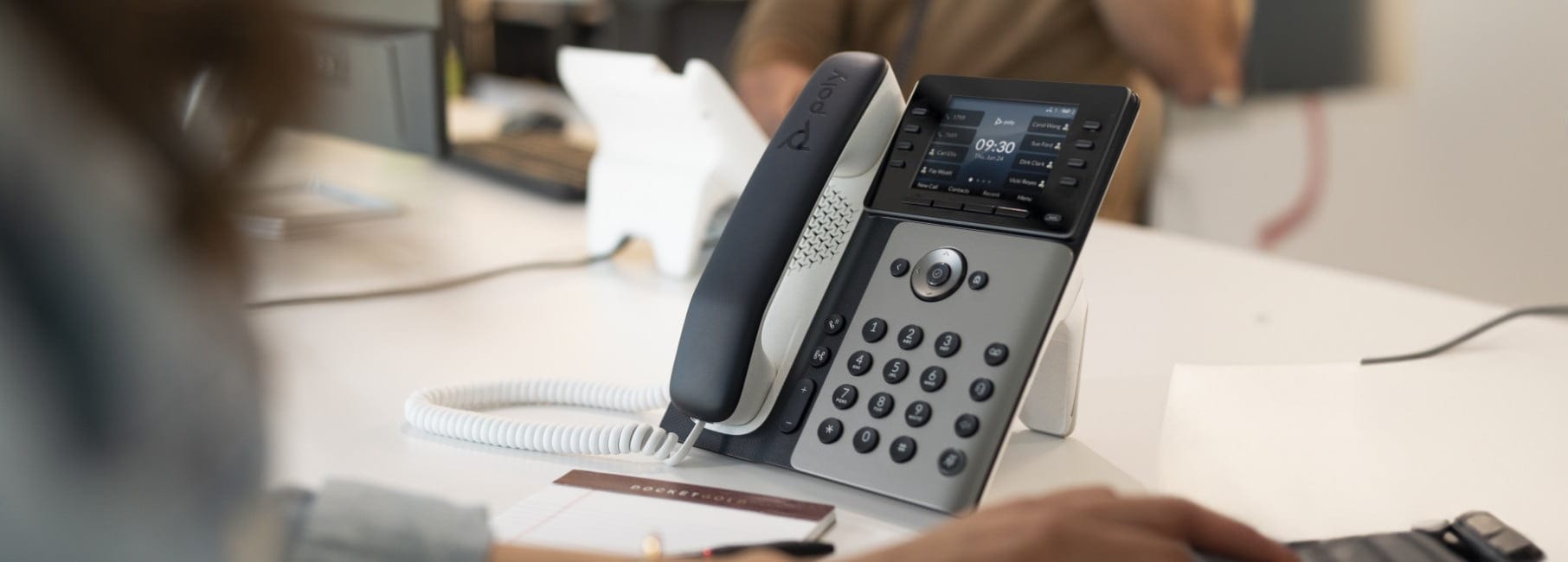 Image of a desk showing HP business phones.