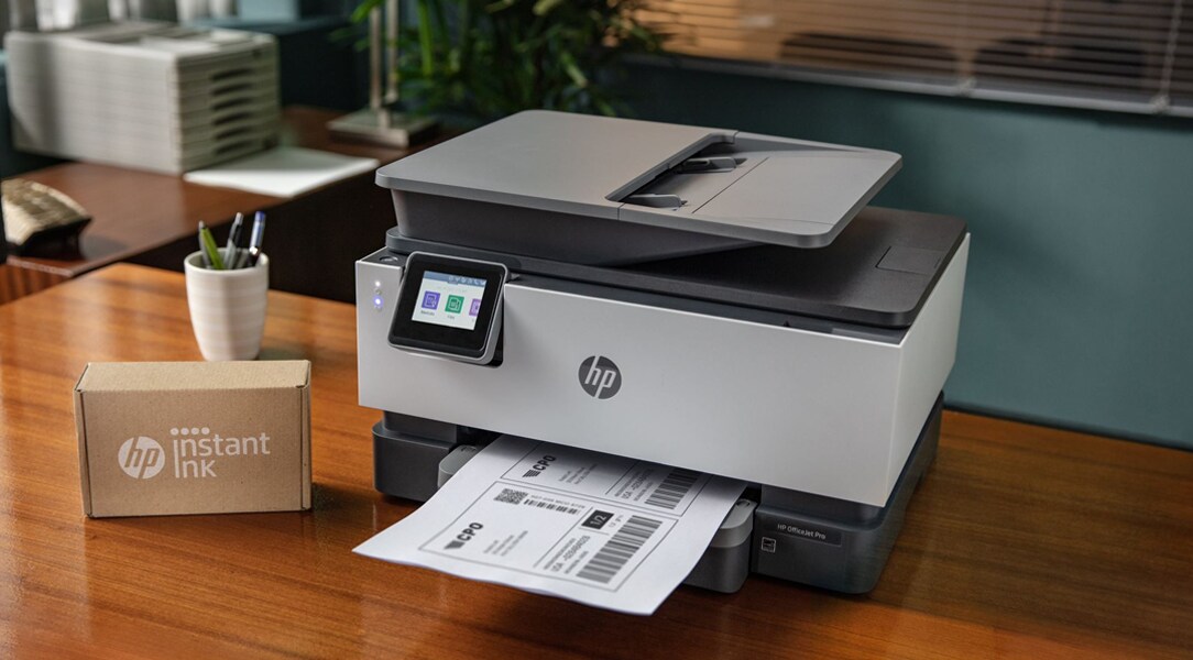 HP Instant Ink box next to Office Jet Pro Printer