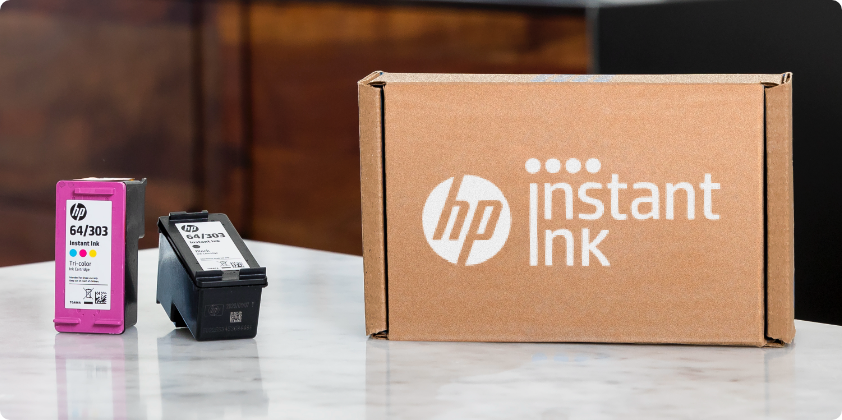 HP Instant Ink box and two HP Original Ink cartridges