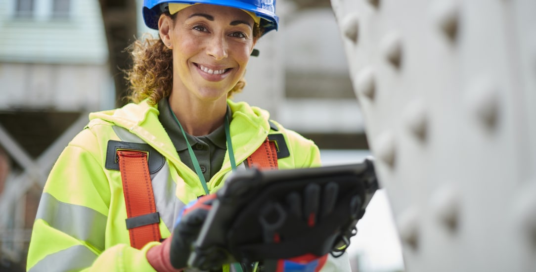 Construction manager using a tablet to manage advanced robotic construction tasks