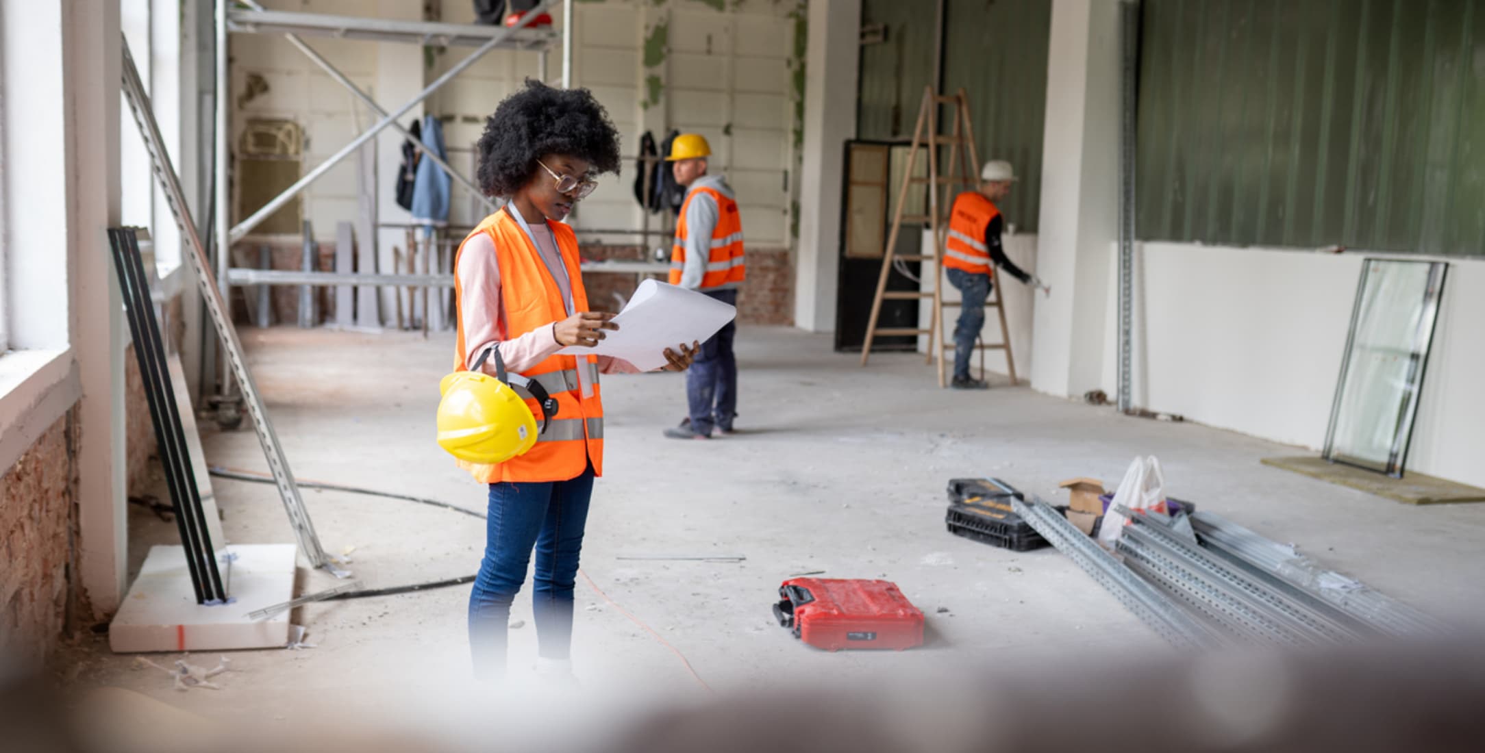 Construction worker ensuring building processes incorporate fire-resistant drywall construction trends