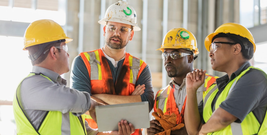 Construction team seeing how a construction robot has simplified communications and operations