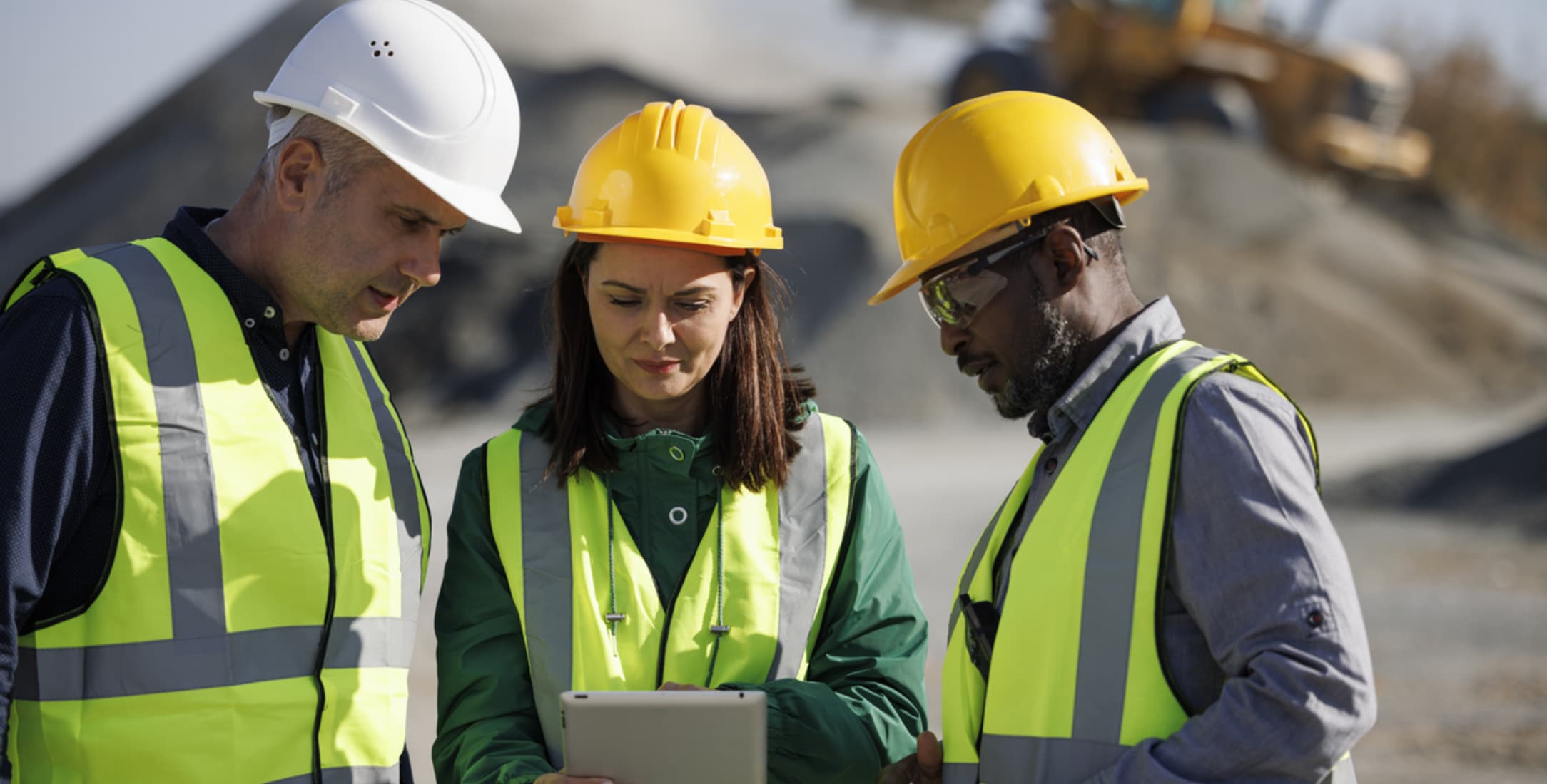 Experienced engineer teaching team members how to integrate new construction technology