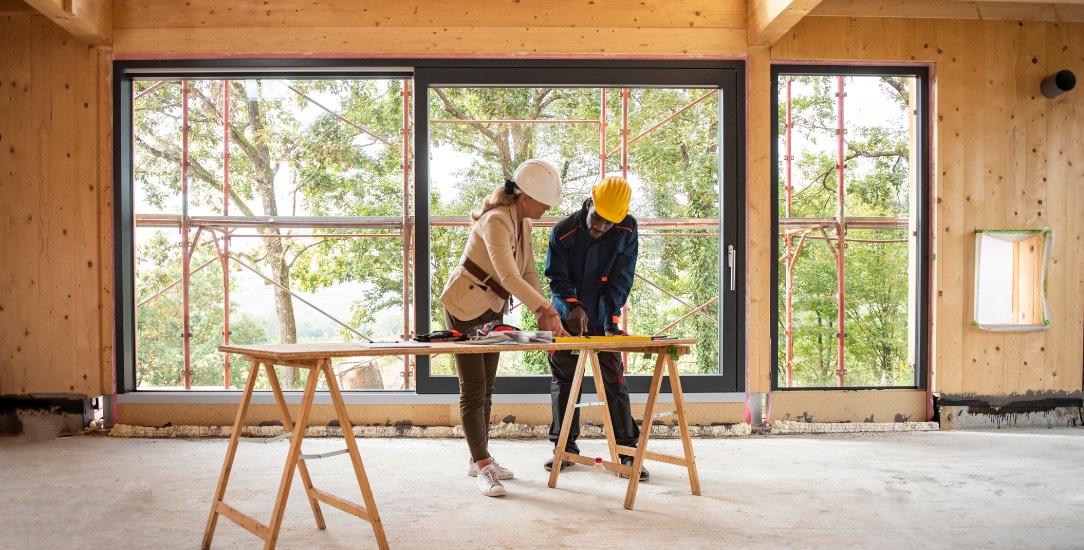 Architect and contractor assessing how using a framing layout robot has impacted a project