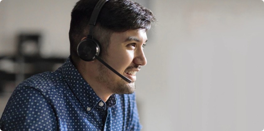 A man having a phone conference in his HP computer.