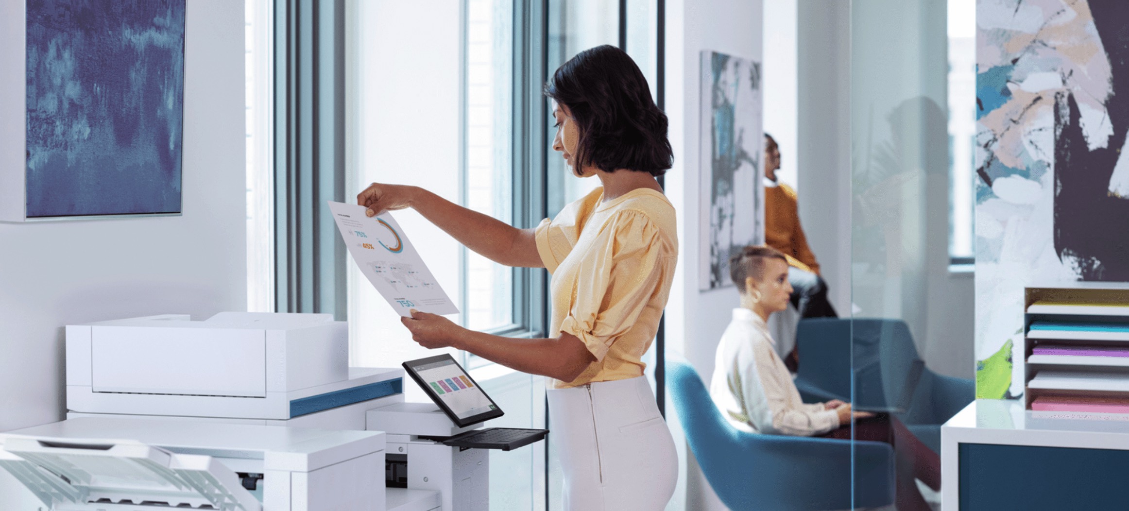 A woman stands in front of an HP office printer, examining a document.