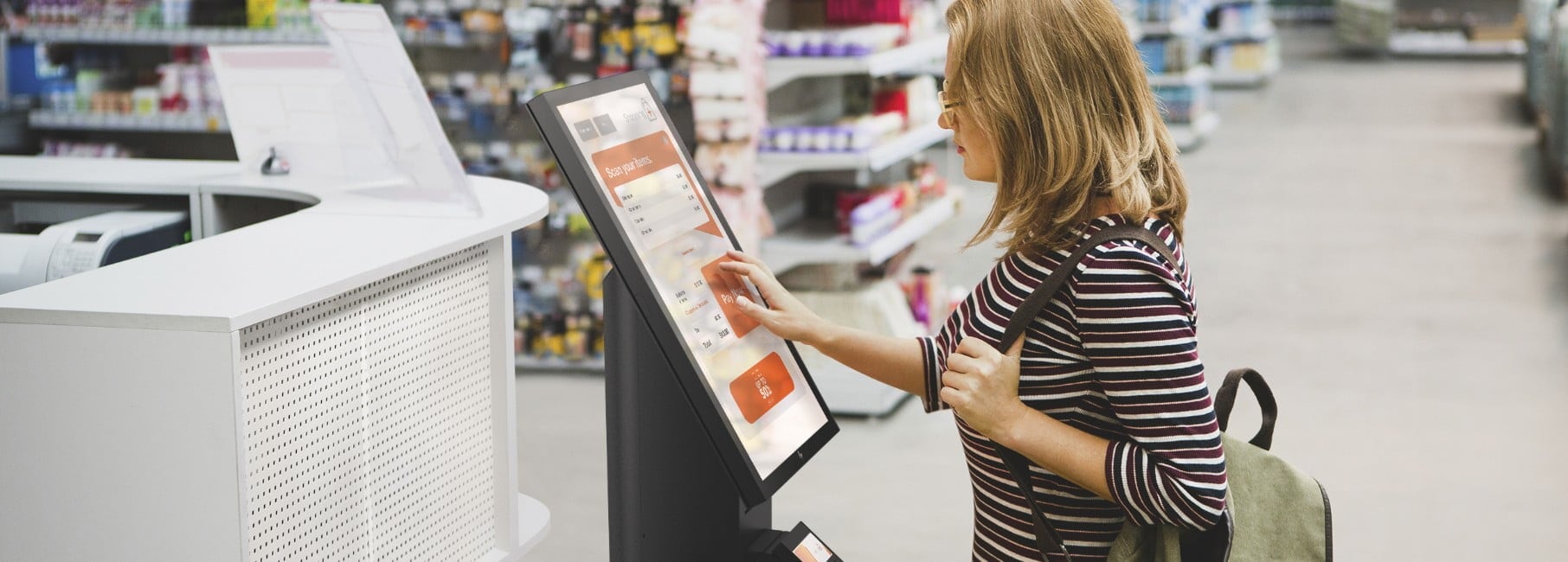 Woman checking some items in an HP Engage Express system in a hardware store