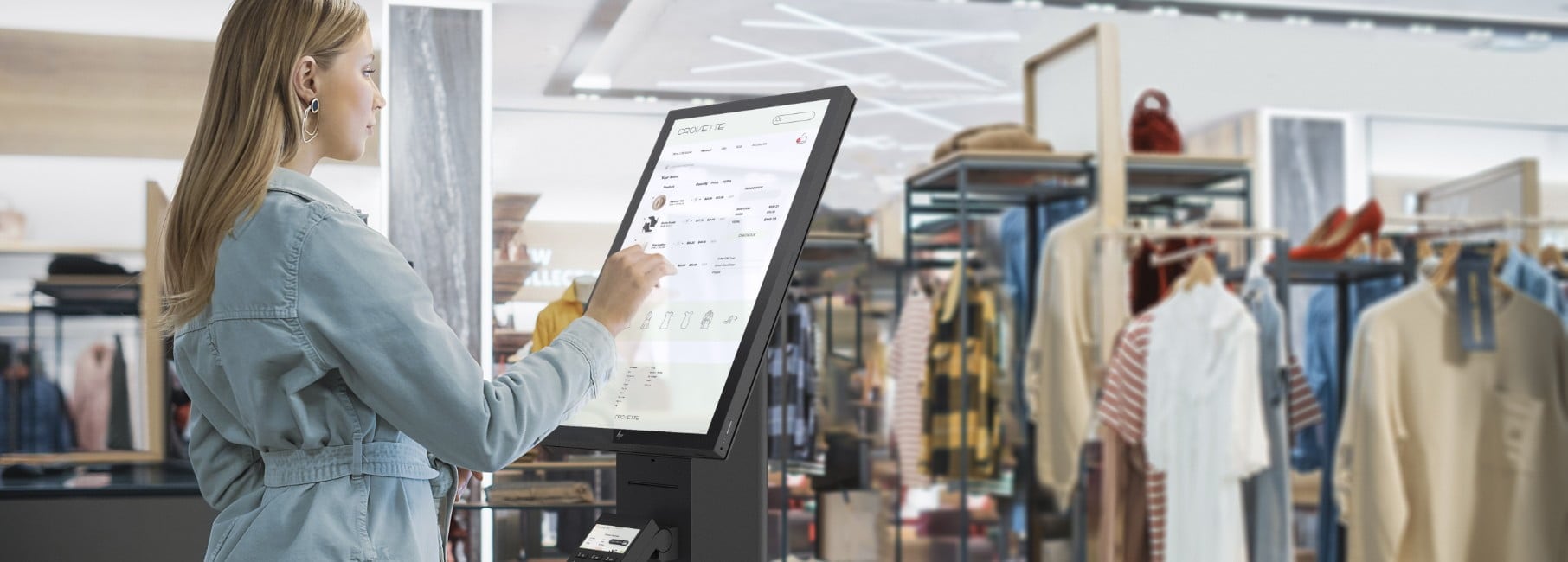 Woman checking some items in an HP Engage Express system in a department store