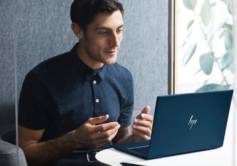 man on a video call , facing the laptop