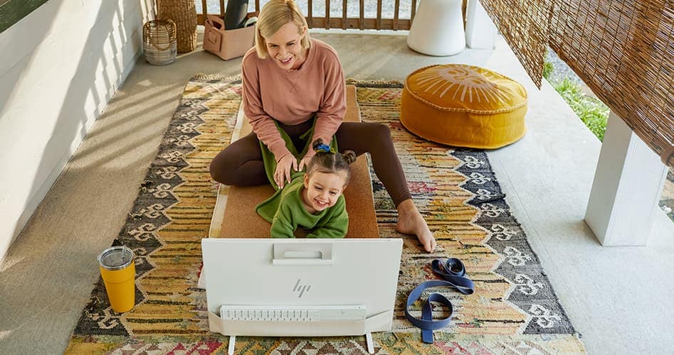 woman and child enjoying on an HP All-in-one Desktop computer