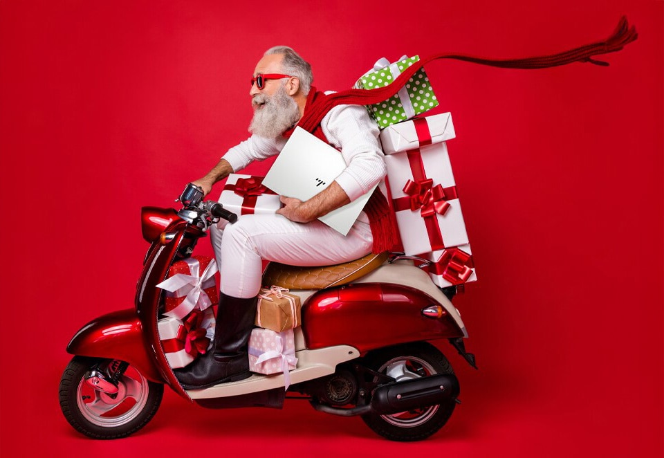 Santa carries HP gifts with his bike