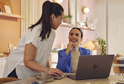 two women working with an Omnibook Ultra