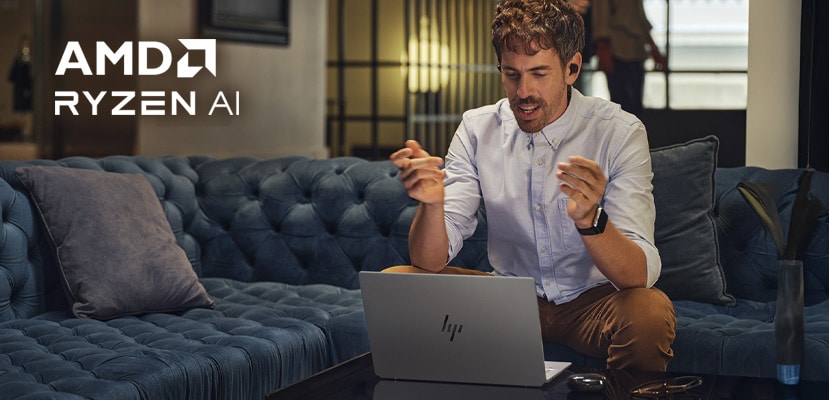 Man working with a HP laptop equipped with an AMD-Ryzen-AI Processor