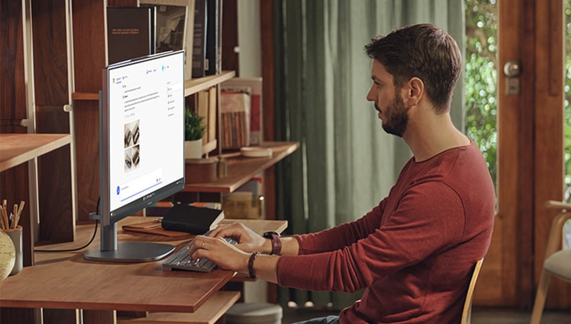 image of man working with HP All in one desktop