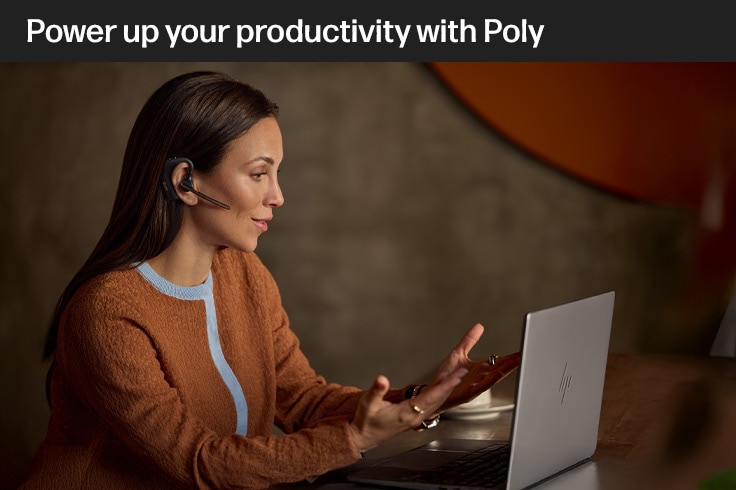 woman is working with a poly headset on her ear