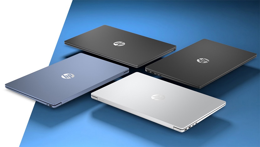 image of 4 laptops sitting on a blue and white background