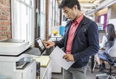 man printing in an office