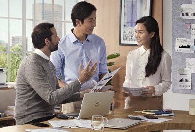 people in an office equipped with HP products