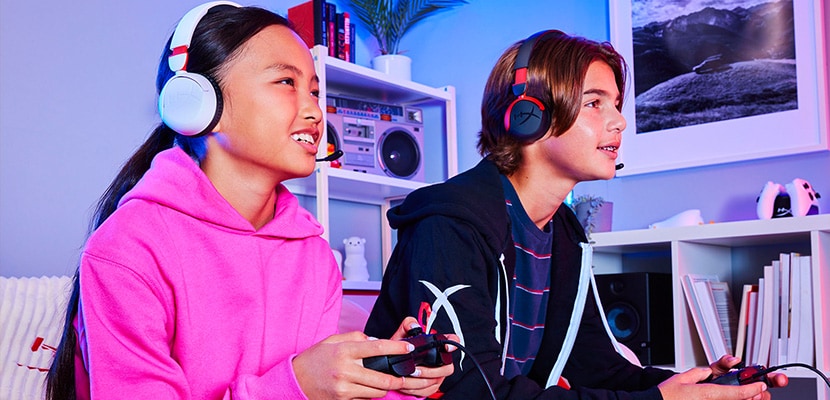 Kids playing games using hyperx headsets