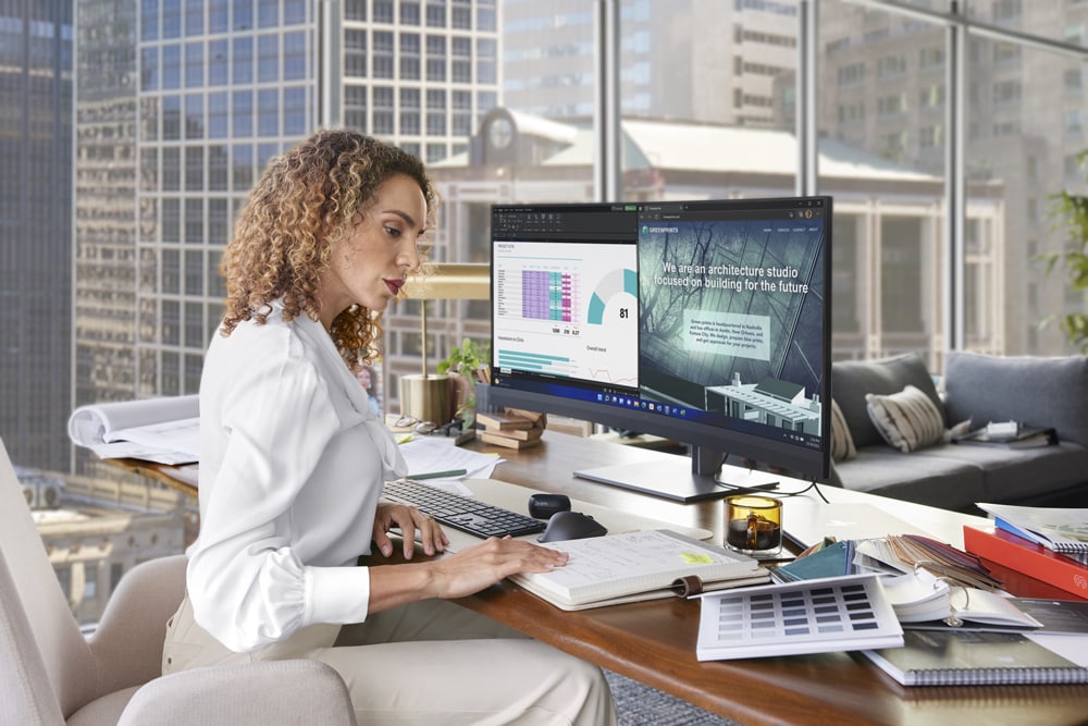 Business Lady working in the office featuring a HP Series 7 Pro Display